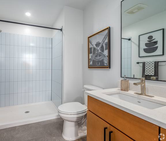 Bathroom with shower and sink at Life At Agora Apartments, Cleveland, OH, 44103