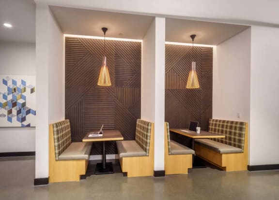 a room with two tables and two chairs and a painting on the wall at NoMa Apartments, California, 94596