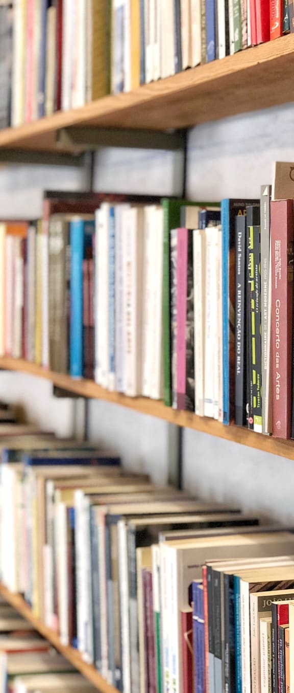 a row of books on a bookshelf