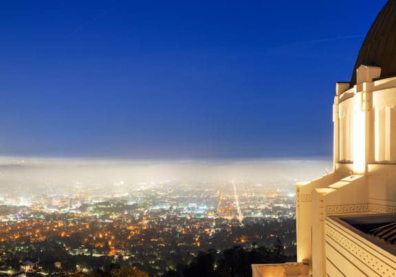 a foggy night view of the city from a building