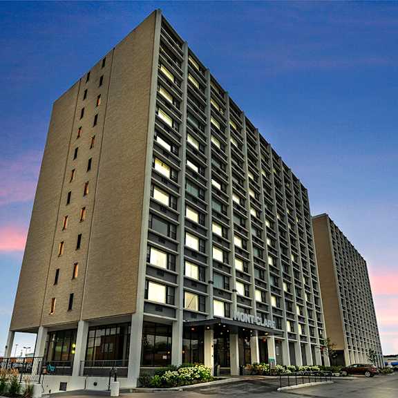 a tall building with a blue sky in the background