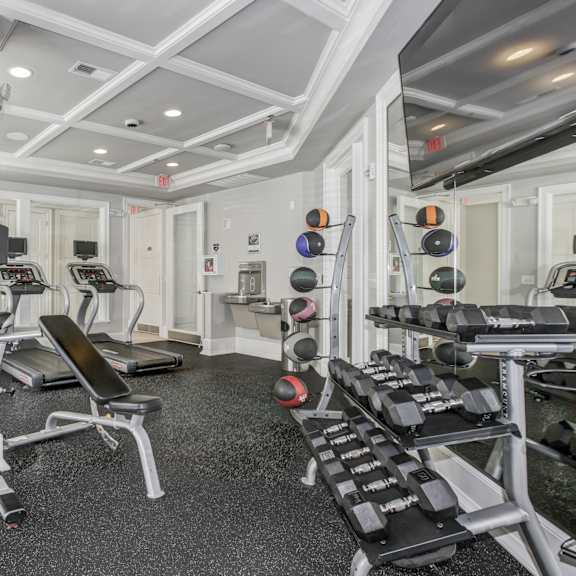 A gym with treadmills and exercise equipment. at Kensington Place Apartments, Woodbridge
