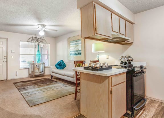 an open living room and kitchen with a couch and a table
