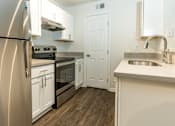 Thumbnail 19 of 49 - Kitchen with stainless steel appliances at Monterey Ranch, Austin, Texas