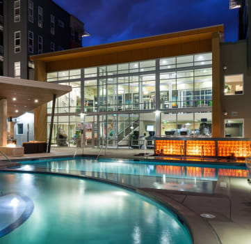 Veranda Highpointe Apartments Pool Area and Building at Night