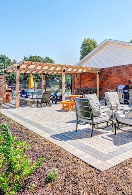 Outdoor patio with grills at Pine Lake Heights apartments