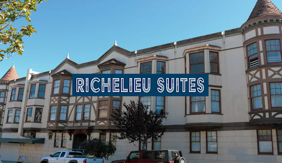 A building with the words "RICHELIO SUITES" on it.