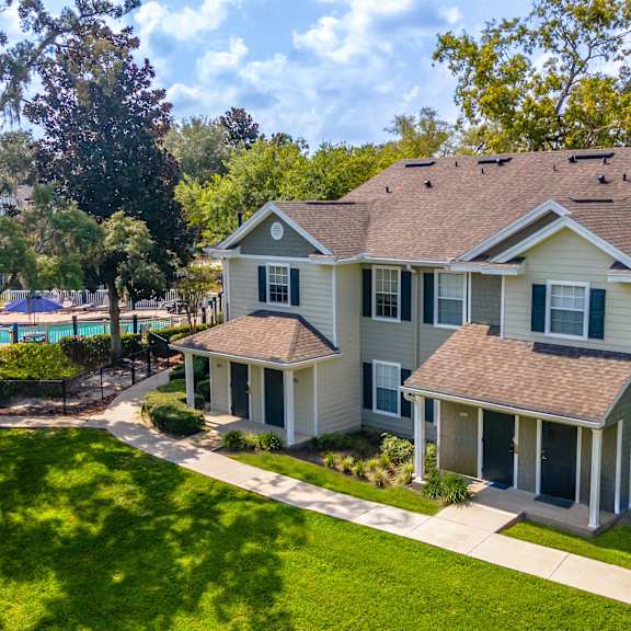 an aerial view of a house with a swimming pool
