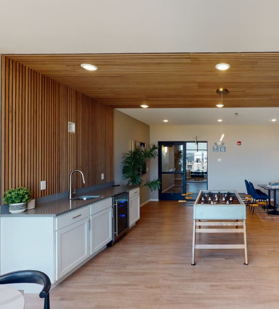a living room with a kitchen and a dining room