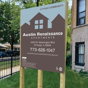 a real estate sign in front of a house photographic print
