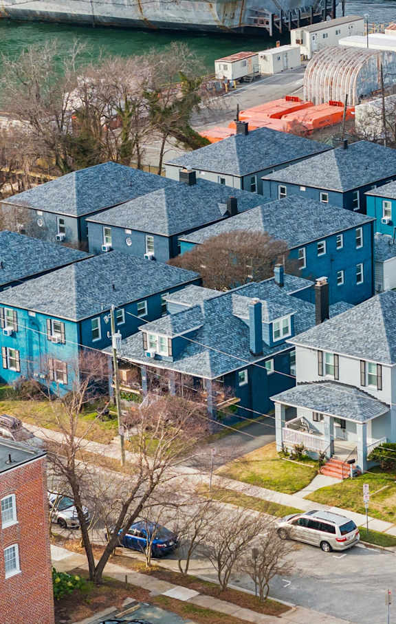 A view of a residential area with houses and cars. at Shipyard Shores Apartments, Newport News, 23607