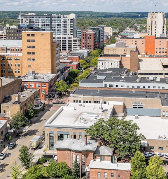 an aerial view of a city with buildings and trees