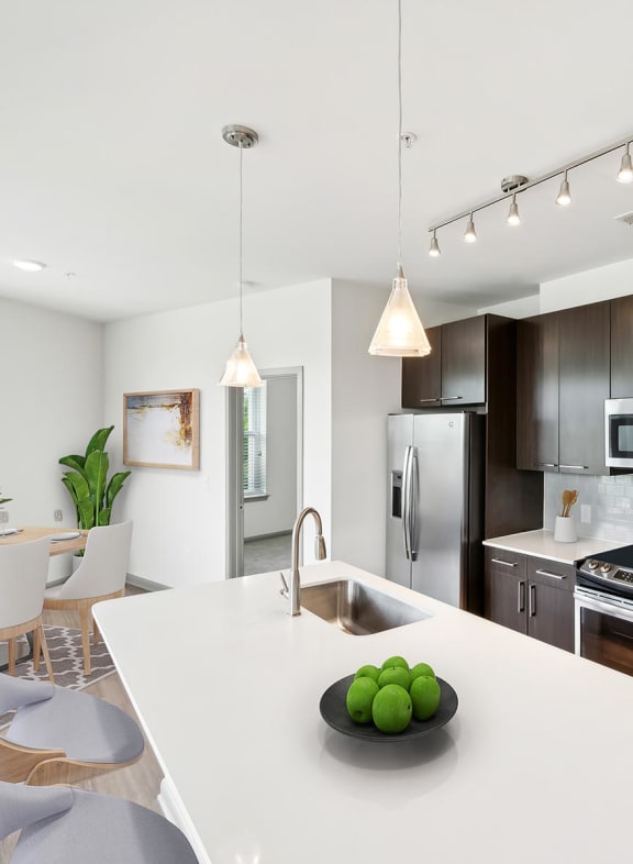 a kitchen and dining area in a 555 waverly unit at Glenwood at Grant Park Apartments, Atlanta, 30316