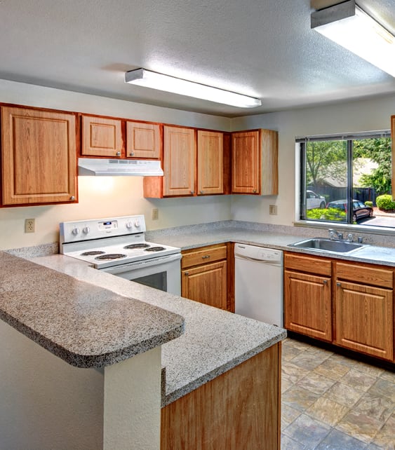 Chambers Creek apartments updated kitchen cabinets, countertops, appliances, and flooring at Chambers Creek Estates, University Place