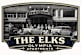 A black and white image of a sign for The Elks Olympia Apartments.