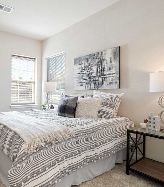 our apartments offer a bedroom with a king sized bed  at Aventura at Hawk Ridge, Lake St Louis