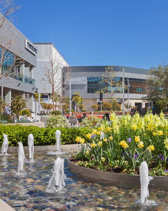 A large building with a fountain in front of it.