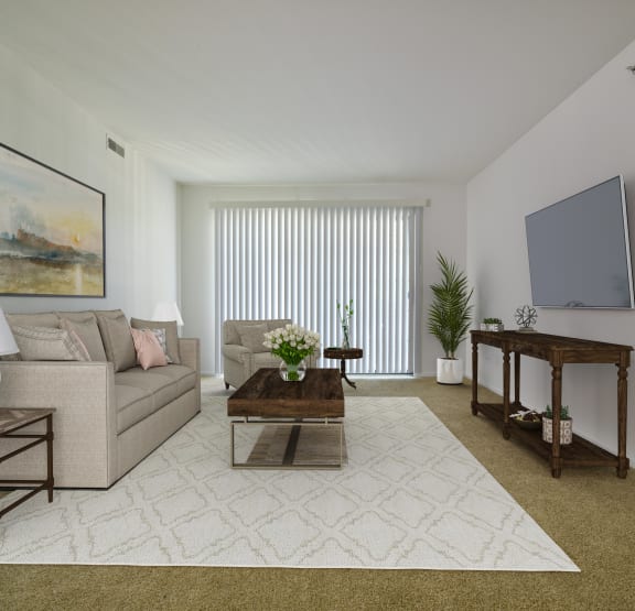 a living room with a couch and a televisionat Thornridge Apartments, Grand Blanc, 48439