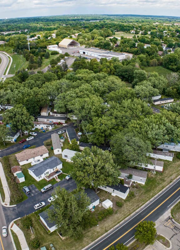 an aerial view of a neighborhood with trees and houses