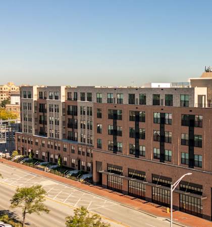 an aerial view of a building on a city street