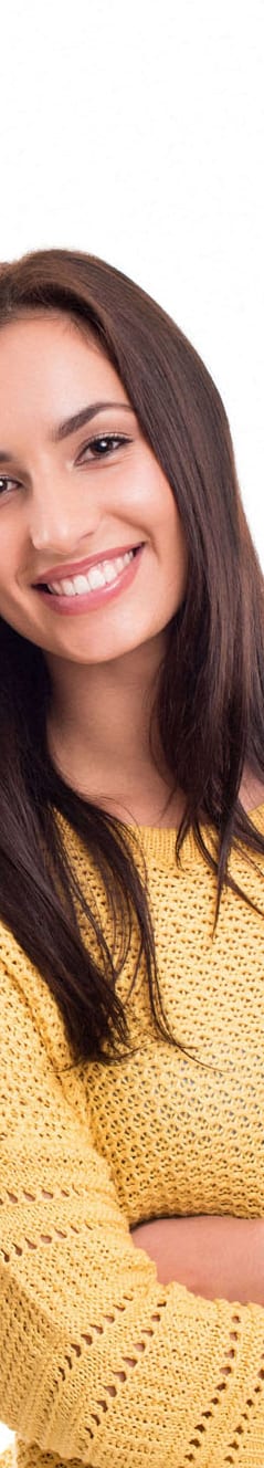 a woman in a yellow sweater with her arms crossed