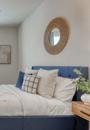 a bedroom with a large bed and a ceiling fan