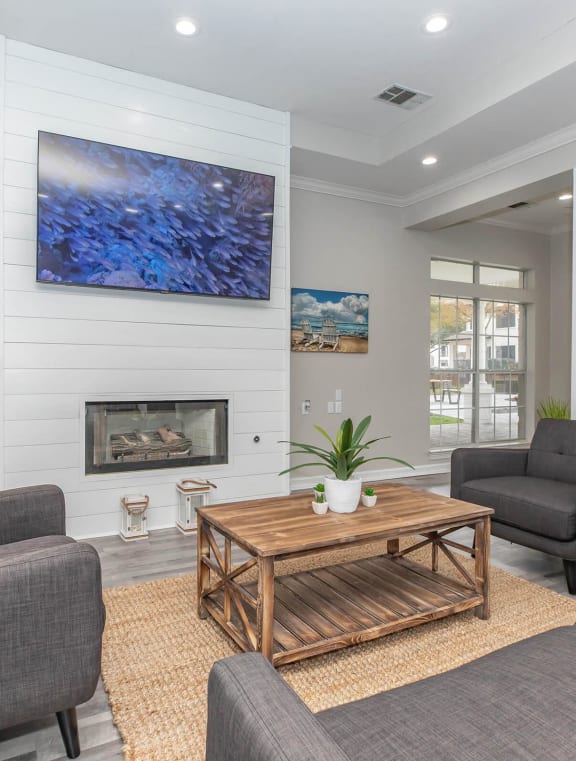 a large living room with a kitchen and a dining room