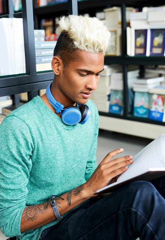 this is a photo of a young man reading at the local bookstore.at Aspen Village, Cincinnati, OH