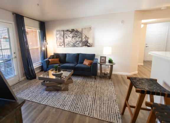 a living room with a couch and a coffee table at Austin Crest Apartments, Reno, Nevada