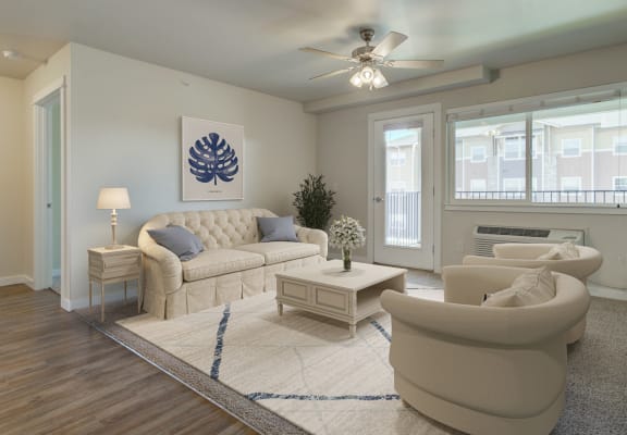 a living room with white furniture and a ceiling fan at Madison Park, Montana, 59718
