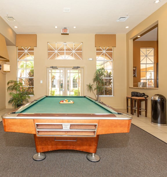 a large swimming pool with a hot tub