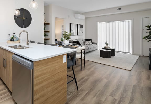 an open floor plan with an island kitchen and living room