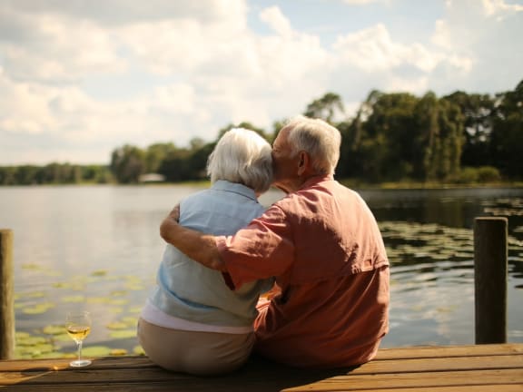 Senior-Couple-Embracing-Dockside Senior-Couple-Embracing-Dockside at Versailles Apartments, Towson, 21204