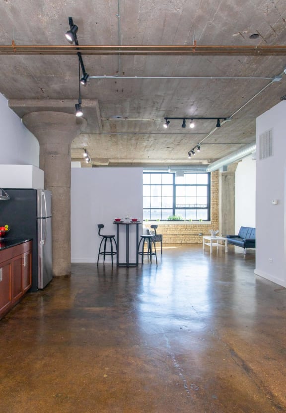 a kitchen with stainless steel appliances and a stove top oven