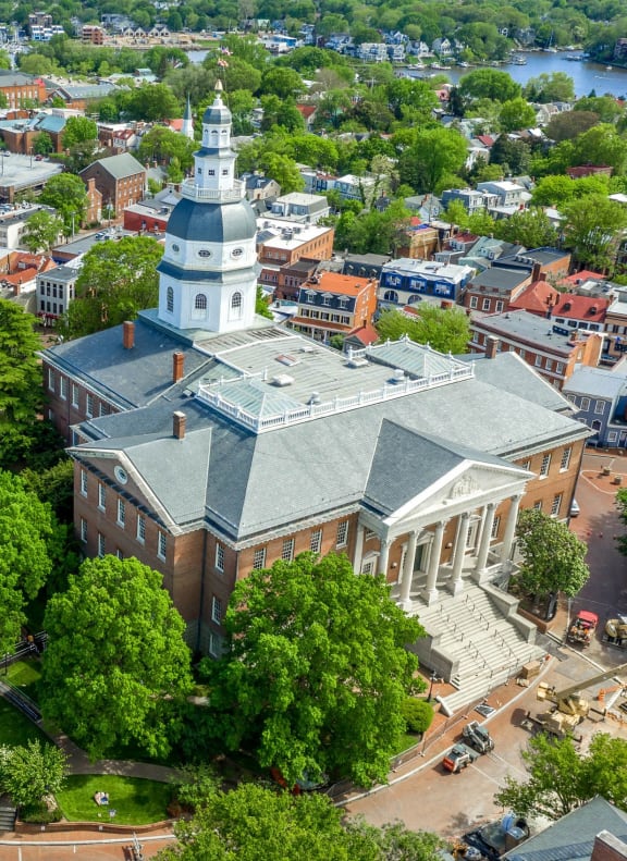an aerial view of a city with a church and a city park