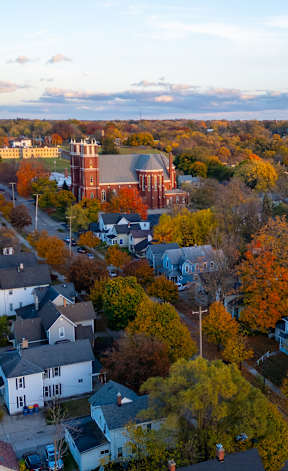 A small town with a church in the center. at The Vue at Rivertown Park Townhomes, Wyoming  , MI, 49418