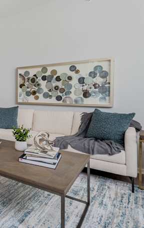 a living room and dining room with a couch and a table