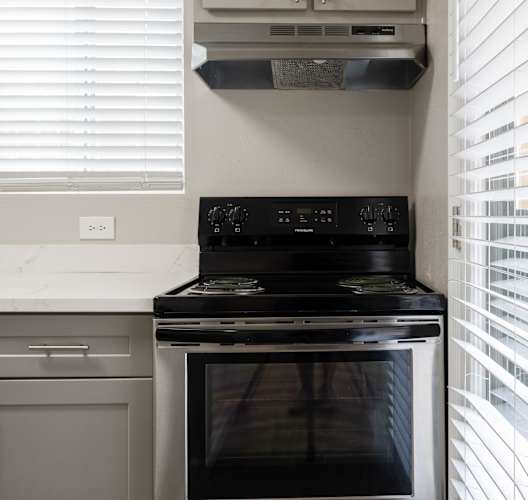 Black stove in kitchen at Brook Meadow Village, Austin, Texas