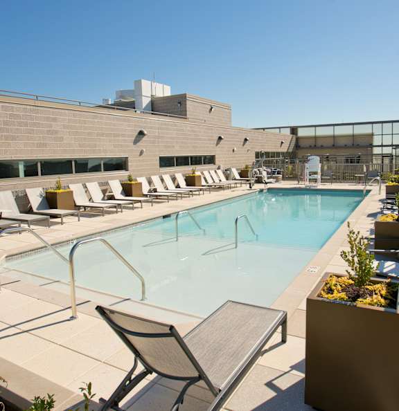 the pool on the rooftop of a building at the ace hotel