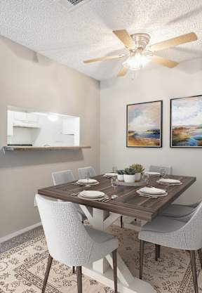 A dining room with a table set for six.