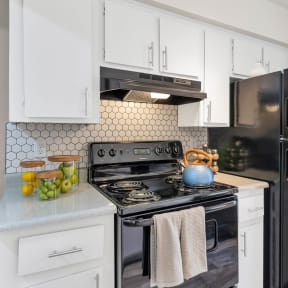 our apartments have a swimming pool with chairs and trees at Glen Brae, Glendale, AZ, 85301