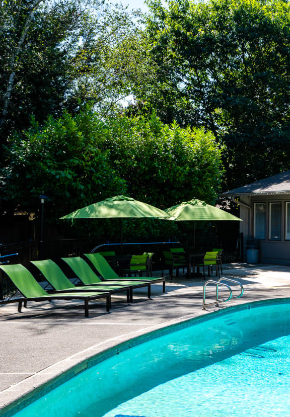 a house with a swimming pool in front of it