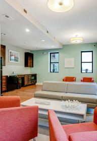 a living room with couches and chairs and a coffee table