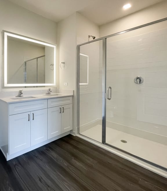 a bathroom with a toilet sink and a shower at Enclave Crystal Lake Townhomes and Apartments, Crystal Lake, 60014