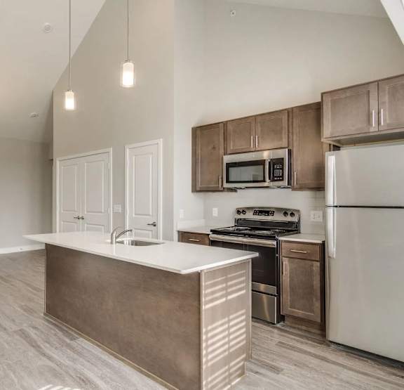a bedroom with a bed and a ceiling fan at 24 at Bloomfield, Bloomfield Township