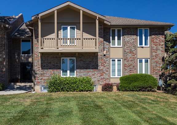The exterior of Regent’s Walk Apartment Homes, featuring well-maintained buildings and landscaping.