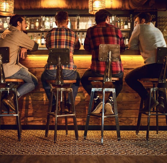people sitting at a bar