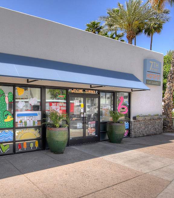 the of outside a store with a window display of fruit and vegetables at Vaseo Apartments, Phoenix, AZ