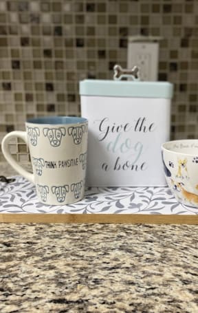 a tray with three mugs on it on a counter
