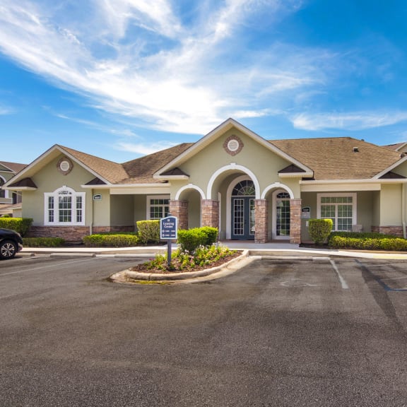 Exterior view of the clubhouse with inviting architecture at Angel Landing apartments in Pensacola, FL